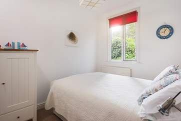 This double room is light and comfortable with views over the rear garden.