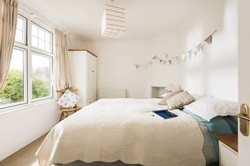 The master bedroom has a king-size bed from which to enjoy the sea views.