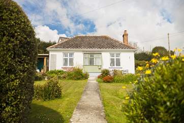 This detached bungalow sits on its own plot alongside the road down into the village, but being on a hill and a bend, this is not a fast road as people slow down (also to look at the view)!