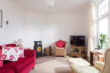 The sitting-room is to the front of the cottage.