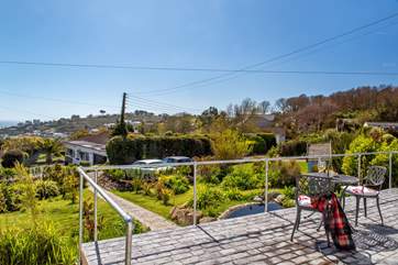 Sit and take in the views of the garden and the sea beyond.