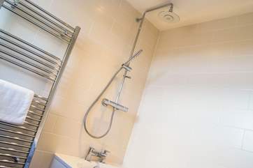 The shower head has a Bluetooth music system and LED lights.