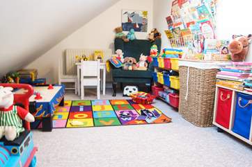 The playroom tucked into the eaves...so amazingly well-equipped you'll never get the little ones to leave!