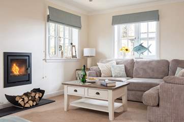 The wall-mounted wood-burner gives a cosy glow all year round.