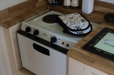 The kitchen is fully fitted with hob and mini oven, microwave, toaster and kettle too.
