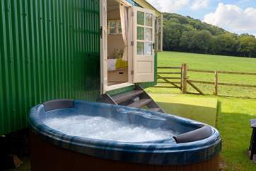 You can soak in the hot tub with countryside views - not overlooked at all.