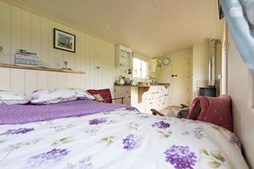 Looking across the hut from the lovely king-size bed to the en suite shower-room at the far end (behind the door).