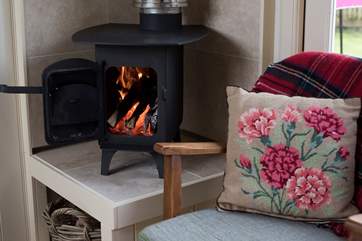 The cosy little wood-burner will add warmth and cosiness on cooler days.
