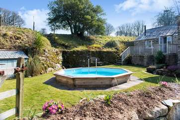 The terrace outside the annexe overlooks the swimming pool. The annexe is accessed via the small flight of steps in the background.