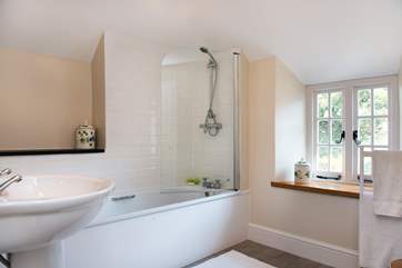 The main bathroom enjoys views over the back garden.
