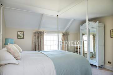 The second bedroom has a gorgeous five-foot four-poster bed.