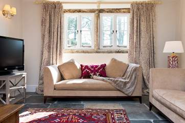 The afternoon sun streams in through the lounge windows.