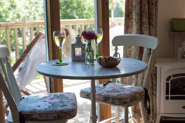 The dining-table is positioned to look out over the treetops.