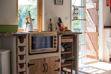 There is a mini oven with double hob, fridge, toaster and kettle too.