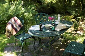 There's a lovely private spot in the garden to sit and enjoy the surroundings by the nature pond.