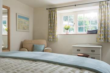 This double bedroom is also beautifully furnished and looks out onto the garden.