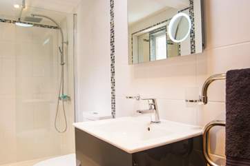 The shower-room has a drench-head shower.