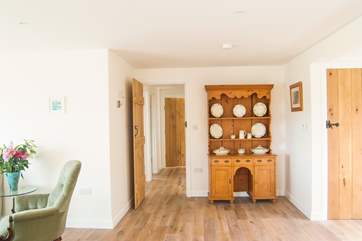 The bedroom corridor leads off from the open plan living-room.
