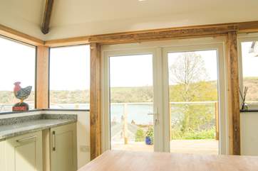 Doors lead out to the deck from the kitchen so you can easily eat outside.