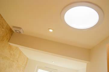 Both bathrooms have clever light tubes for additional light.