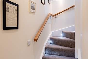 The stairs snaking up to the first floor.