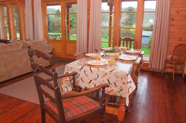 There is a lovely farmhouse dining table with plent of room for all.