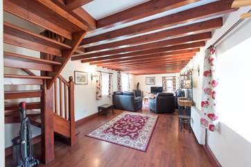 Stairs (on the left of the photograph) lead up to the bedrooms.