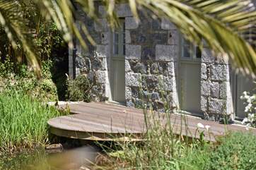 The rear terrace backs onto a pond (please take care this area is unfenced).