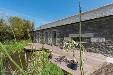 Marbles' rear decked terrace backs onto a large pond (please take care the pond is not fenced).
