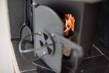 With a little wood-burner to supplement the warmth on chillier days.