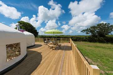 Rosewood Yurt sits proud on its huge deck overlooking open countryside.