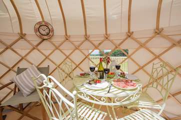 The pretty little dining-area sits next to the window to appreciate the countryside views.