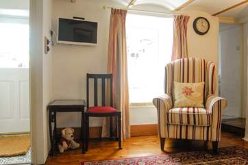 The sitting-room looks out to the small enclosed courtyard.