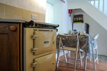 This Aga electric cooker sits happily in the ancient cottage.