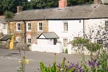 Mapled Cottage is the white cottage in the middle of the small terrace.