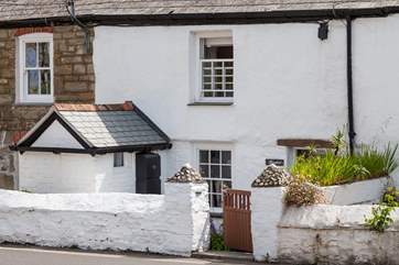 Mapled Cottage is located in a terrace of cottages, and overlooks a road. There are two steps leading down to the property.