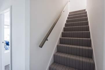 The stairs down to the lower ground floor where you will find the master bedroom, study and bathroom and access out onto the garden.