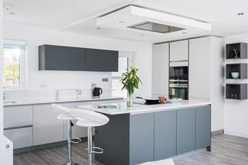 The stylishly cool and funky kitchen where you can change the colour of the lights above the island to suit your mood.