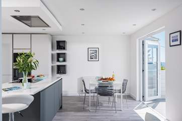 There is room to dine in the kitchen or you can move the table out onto the fabulous deck.