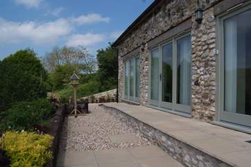 The Studio is a stylish brand new barn conversion with a patio the full length of the building and the most beautiful views.