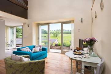 There is plenty of room for the dining-table in this light-filled space.