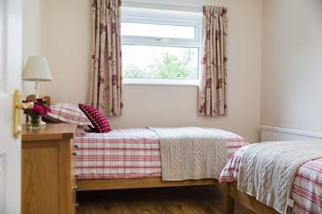 The twin bedroom is furnished with two 3ft single beds.