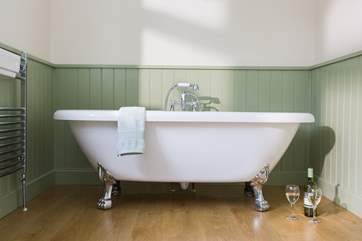 The roll-top bath, perfect for a long soak after a day out and even better with a glass of something!