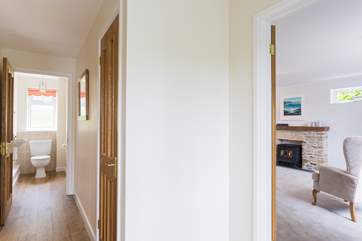 The entrance hallway with the sitting-room to your right, the kitchen/diner to your left and a downstairs loo straight ahead.
