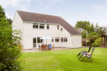 The back garden is large enough for relaxing, al fresco dining or playing games.