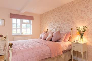 Once again, this bedroom, with its individual styling, is spacious, light and very comfortable.