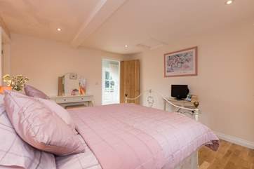 Another view of this bedroom. The en suite bathroom is just off to the left of this picture.