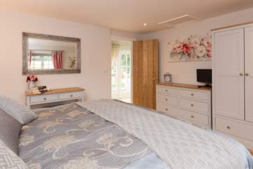 Another view of this bedroom so that you can get a full impression of the space and quality. The French windows seen through the doorway lead into the courtyard at the front of the property.
