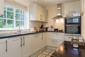 The well-equipped kitchen has all that you will need during your holiday here. The dining area also has a large dresser with even more items provided to make your stay a wonderful one.