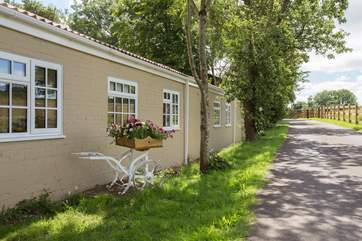 This is the side of the property that you will see first, on arrival. Parking is around to the end and to the left.